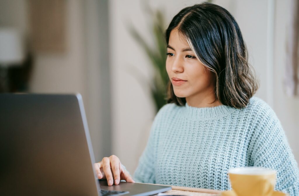 Balancing a part-time job with studies
Young woman working with laptop